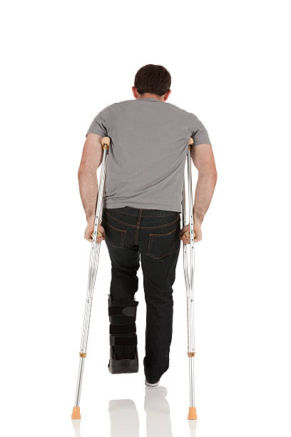 istock Injured man walking with the help of crutches 185104209
