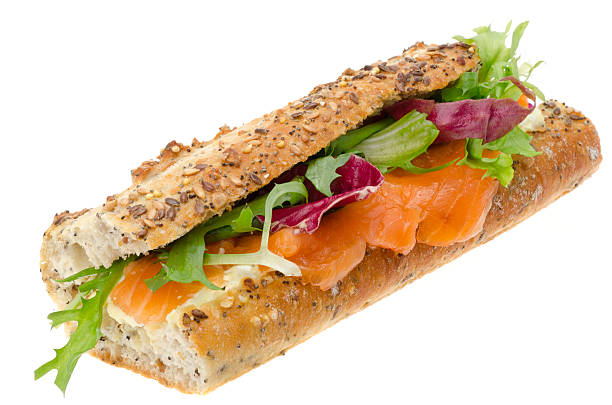 Baguette filled with cream cheese and smoked salmon - studio shot with a white background