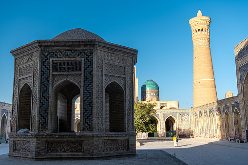 JUNE 27, 2023, BUKHARA, UZBEKISTAN: Inner courtyard of the Kalyan Mosque, part of the Po-i-Kalyan Complex in Bukhara, Uzbekistan. Sunset sky with copy space for text