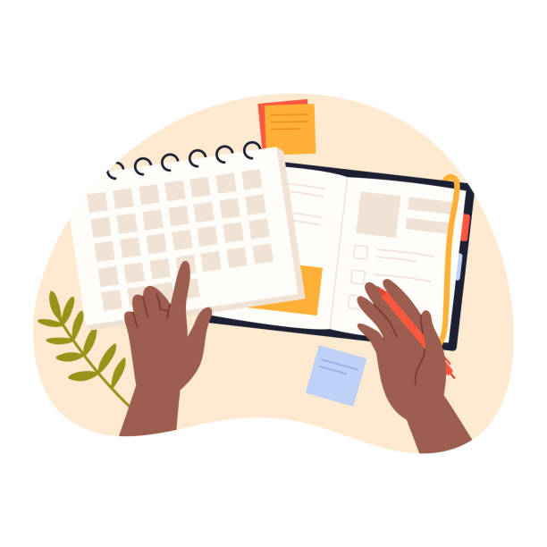 istock Hands of person pointing to date on calendar, holding pen to write in diary or journal 1851044502