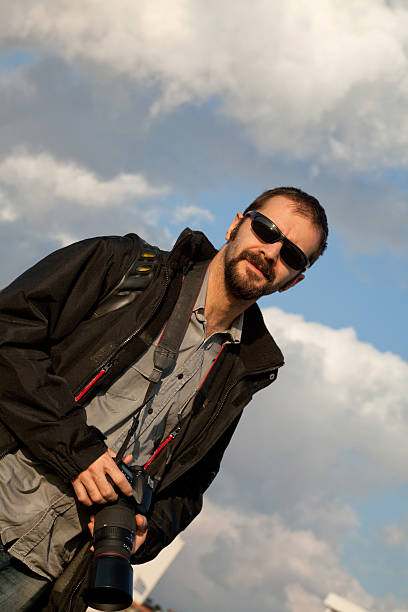 istock young  photographer with the camera 185104506