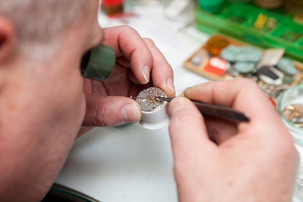 istock Watchmaker in his office...repairing wrist watch 185104614