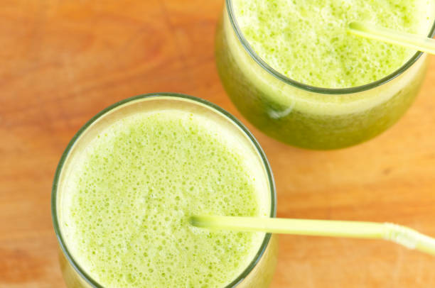 istock Two Green Smoothies on Wood from Above 185104705
