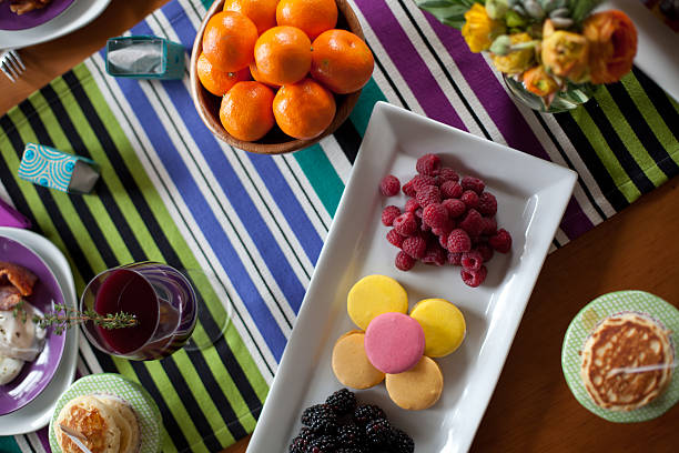 Brunch table with fruit, pancakes and cookies stock photo