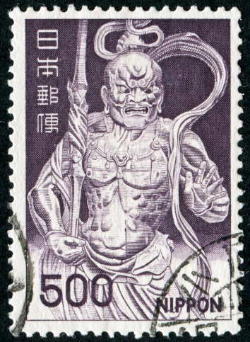 Cancelled Stamp From Japan Featuring A Scary Looking Character