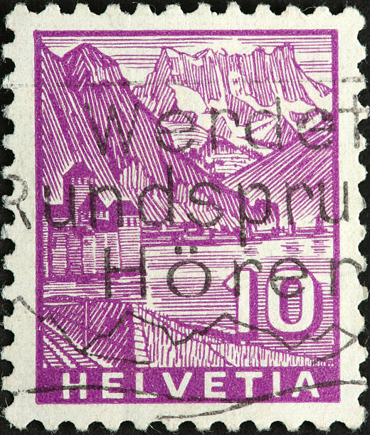 istock Swiss lake, mountains,and castle on a stamp 185105273