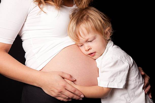 istock Pregnant belly with little boy 185105313