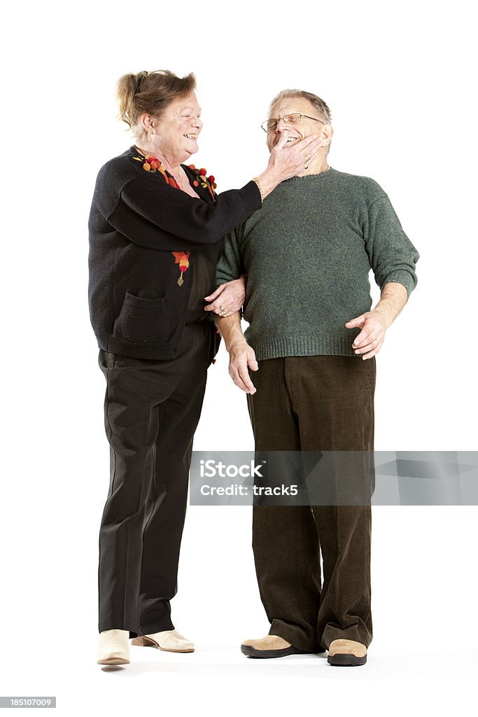Anziani: Coppia senior in un allegro messaggio - Foto stock royalty-free di 60-69 anni