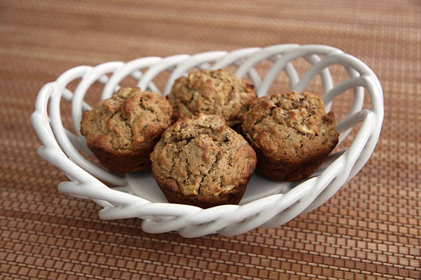 Healthy Apple, Apricot, and Walnut Muffins in Basket stock photo