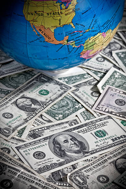 istock Geographical globe on US dollars: global finance personified 185107198