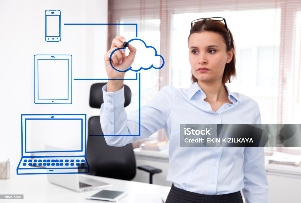 Businesswoman drawing a Cloud Computing schema Cloud computing Adult Stock Photo