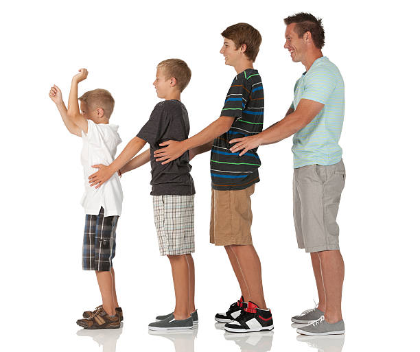 istock Man and his children standing in ascending order 185107365