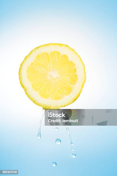 Fresh Lemon Stock Photo - Download Image Now - Lemon - Fruit, Squeezing, Blue Background
