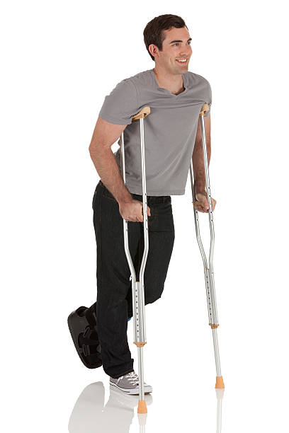 istock Injured man walking with the help of crutches 185107734