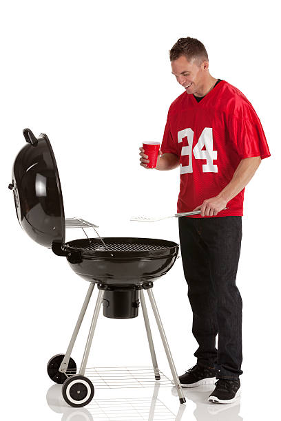 istock Sportsman cooking at barbecue grill 185108220