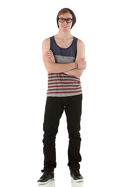 Man standing with arms crossed Man standing with arms crossed sleeveless top stock pictures, royalty-free photos & images