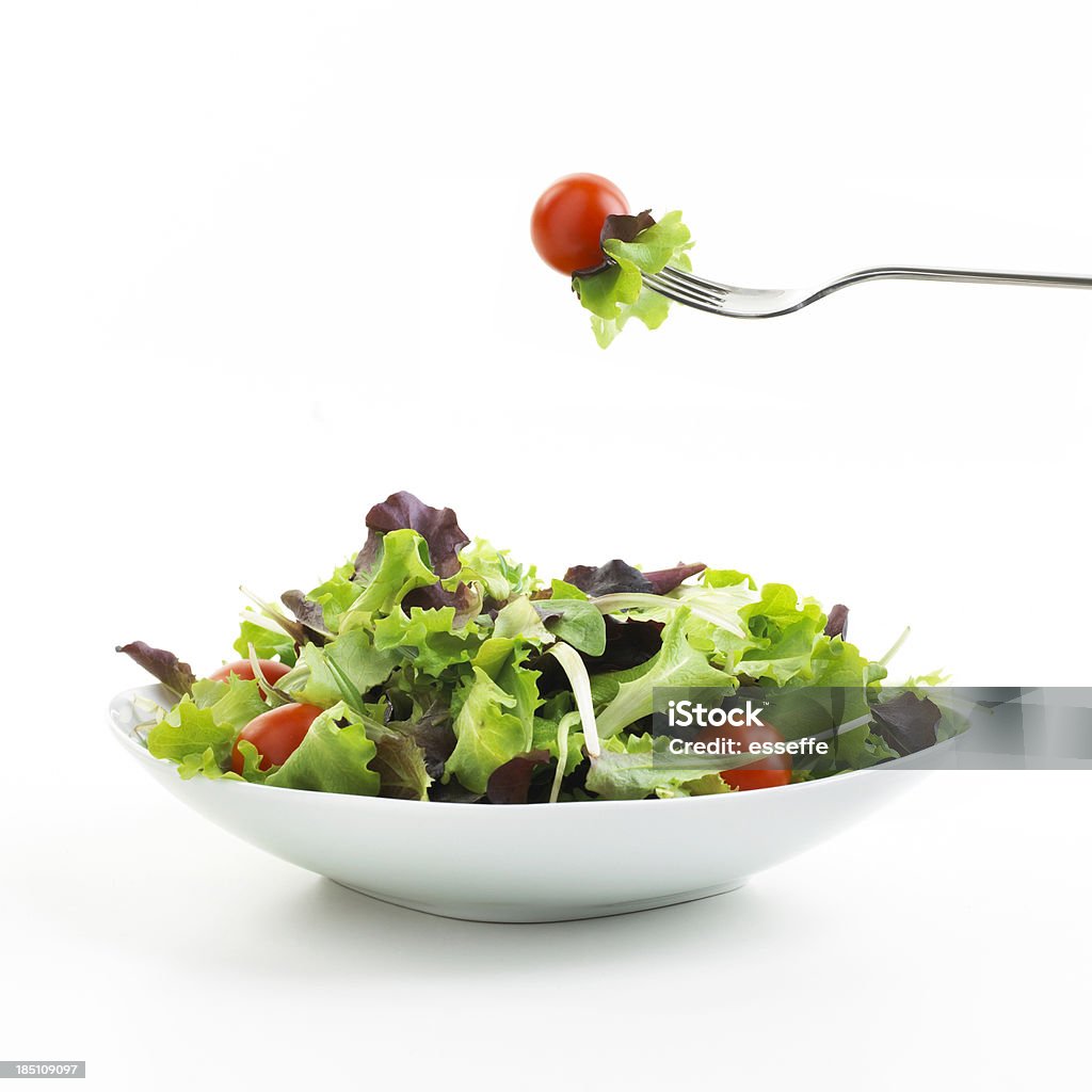 Assiette de salade avec fourchette - Photo de Salade composée libre de droits