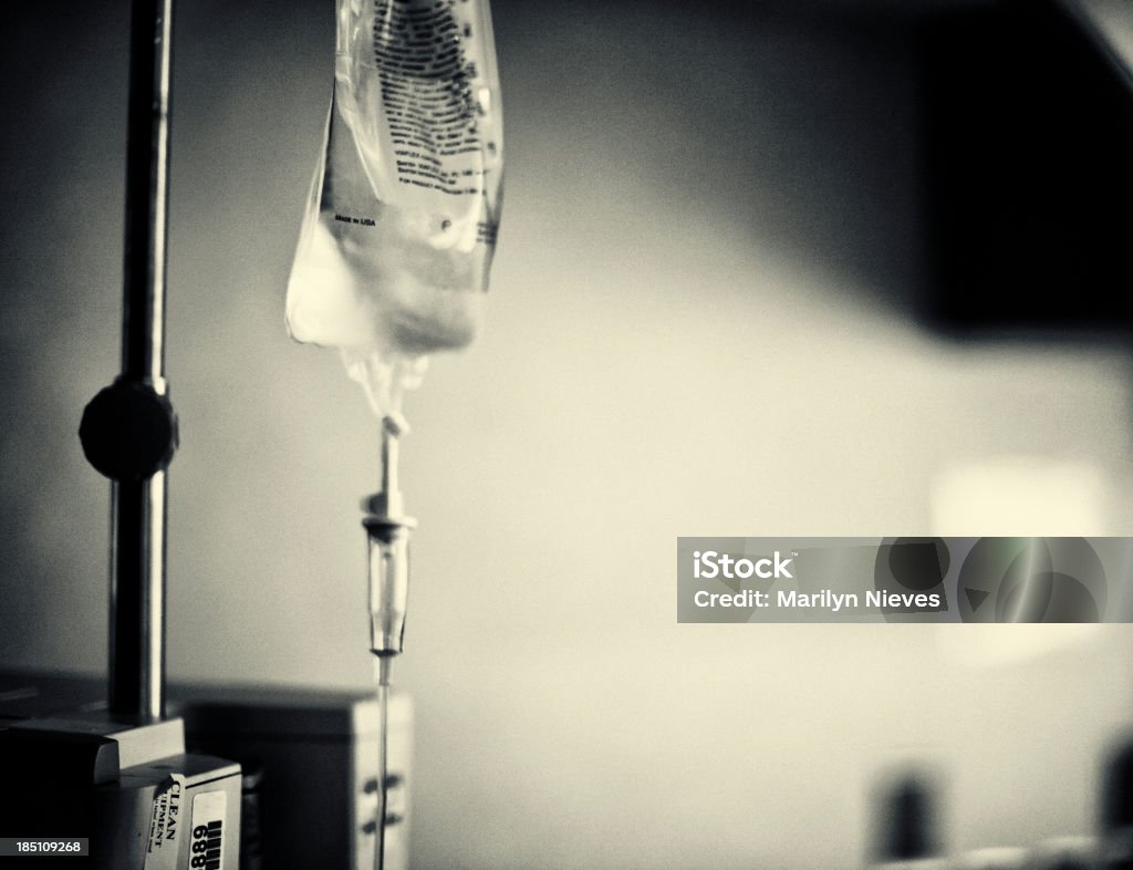 IV Drip IV bag next to hospital bed. IV Drip Stock Photo