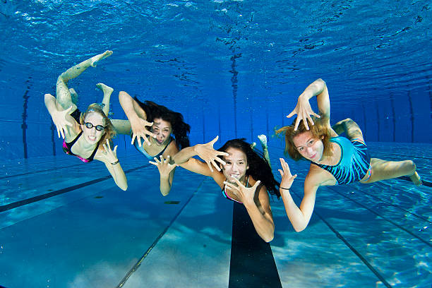 istock Female swimmers having show underwater 185109533