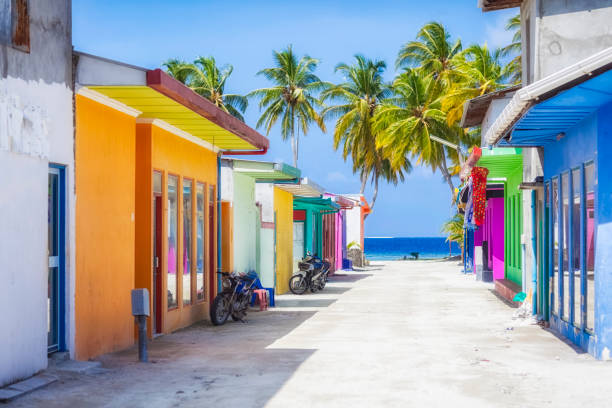 Shopping Street of Maldives ( Maafushi ) Shopping street with typically colorful house facades in Maafushi a local island in the Maldives. exotic vacations stock pictures, royalty-free photos & images