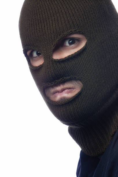 istock Burglar with mask and a menacing stare 185110087