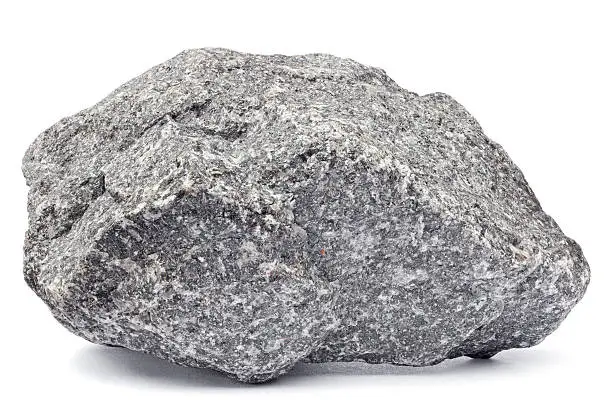 Close-up of a grey rock isolated on white. Focus is front to back.