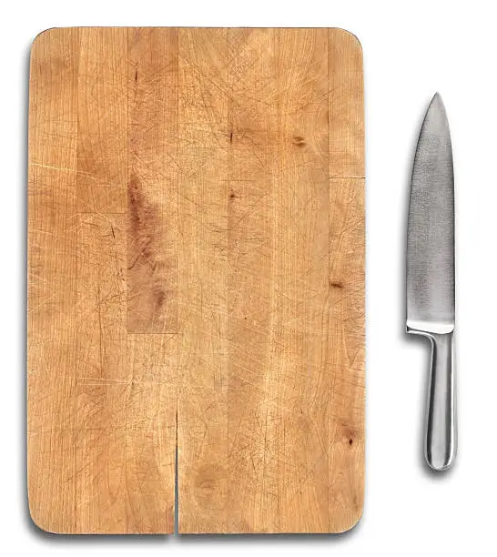 Photo of Wooden bread cutting board with stainless steel knife isolated