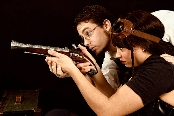 istock Steampunk couple aim a gun together 185110376