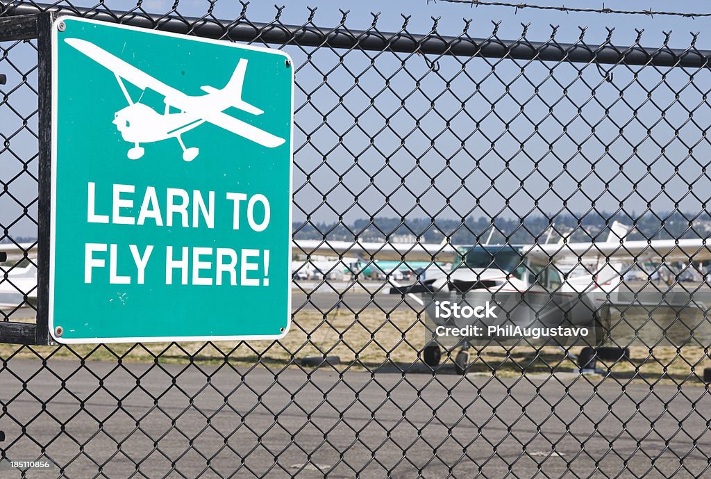 Learn To Fly Here Sign At Airport Stock Photo - Download Image Now