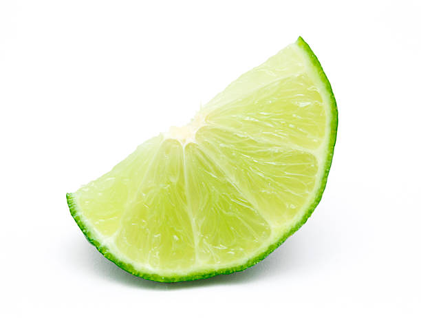 lime slice - lime fruit citrus fruit portion stock-fotos und bilder