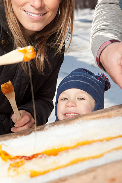 istock Happy boy wants to eat maple taffy 185111744