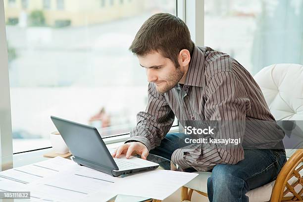 Young Man Looking At Computer Stock Photo - Download Image Now - Adult, Adults Only, Beautiful People