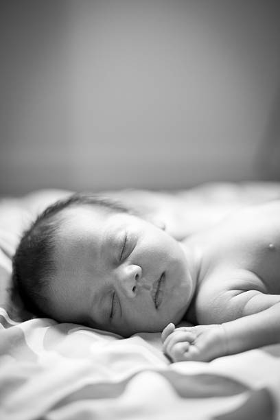 istock Black and White Image of Newborn Sleeping, With Copy Space 185112362