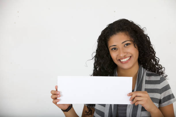 istock Young woman holding white sign card 185112464