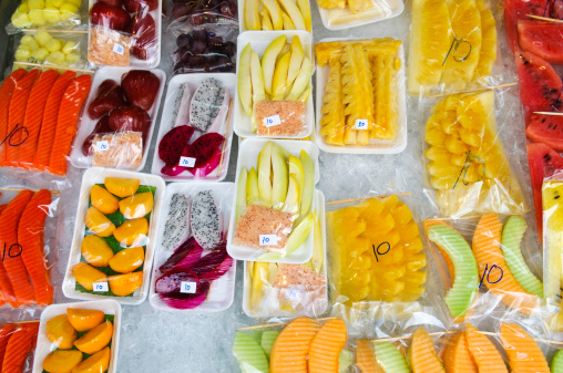 A variety of fresh fruit for sale and ready to eat at a street market in Chiang Mai, Thailand