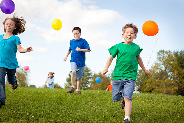 istock Group of Children Standing with Balloons, Color Image 185113102