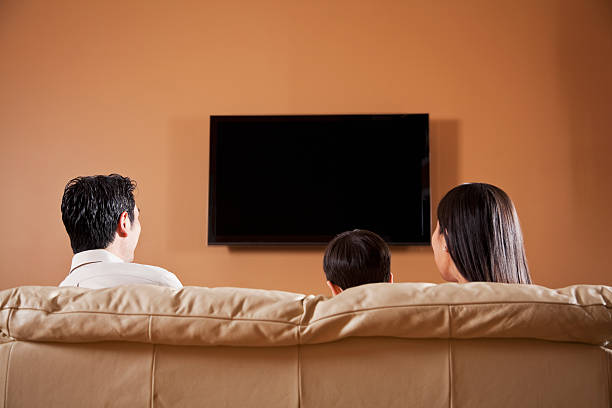 istock Family watching TV 185113453
