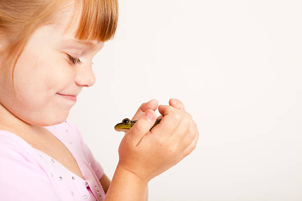 istock Young Princess Smiling at Frog, With Copy Space 185113800