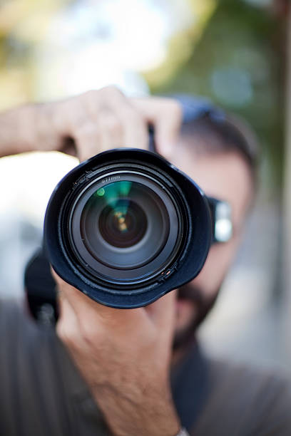 istock photographer and lens close up 185114211