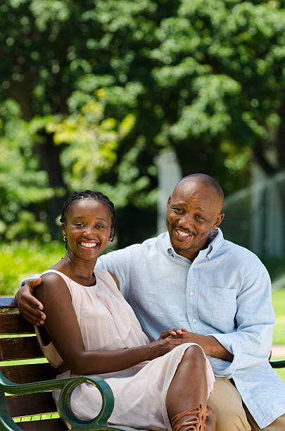 istock Cheerful African couple in the park 185114272
