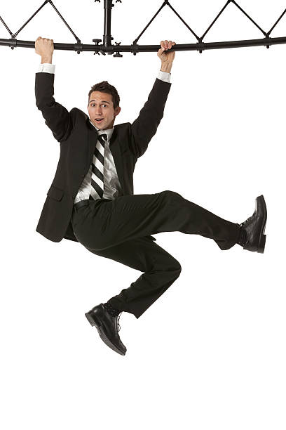 istock Businessman hanging from a metal structure 185114348