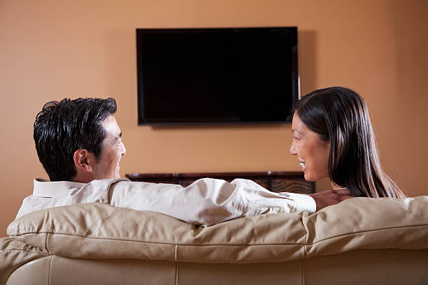 istock Asian couple watching TV 185114401