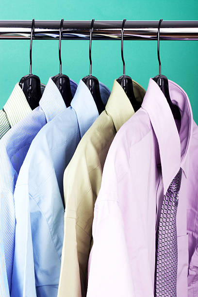 istock Rack of men's hanging shirts and ties 185114543