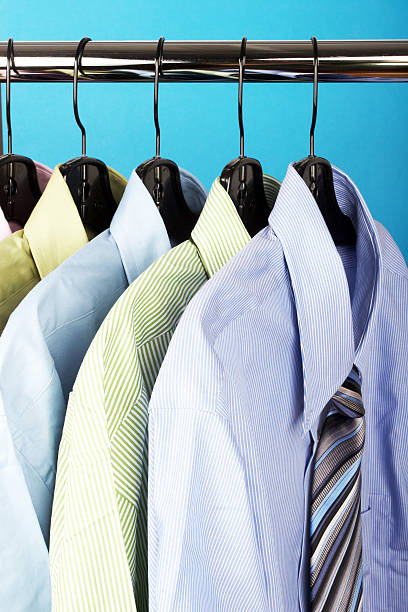 istock Rack of men's hanging shirts and ties 185114544