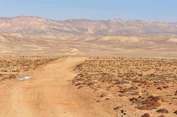Dirt road through desert, Afghanistan stock photo