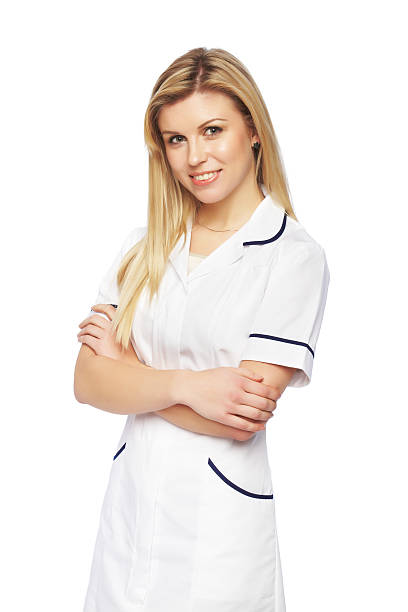 istock Pretty young nurse standing on white with folded hands 185114857