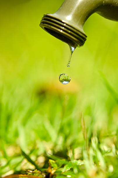 drop - sustainable resources water conservation water faucet стоковые фото и изображения