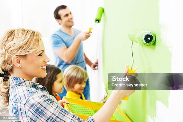 Happy Family Painting Walls Stock Photo - Download Image Now - Painting - Activity, Wall - Building Feature, Family