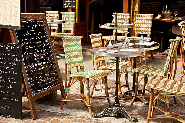 Restaurant in Paris "Colorful tables and chairs in sidewalk cafeParis, France" restaurant france stock pictures, royalty-free photos & images