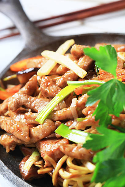 istock Pork stripes meat with noodles and fried vegetables 185115570